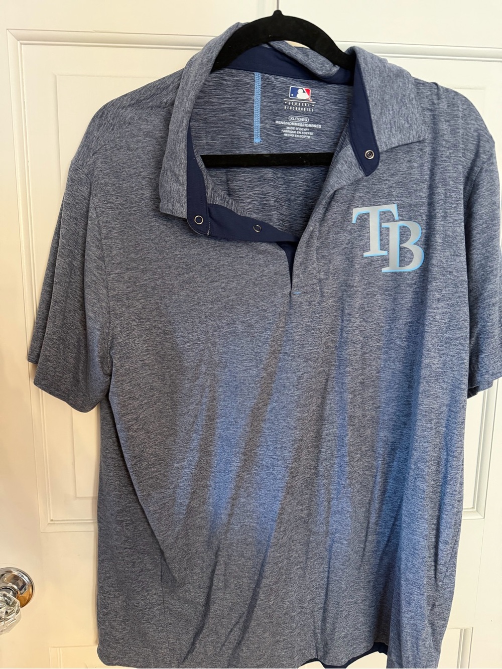 Genuine Merchandise Heathered Navy Blue Polo with Light Blue TB Logo